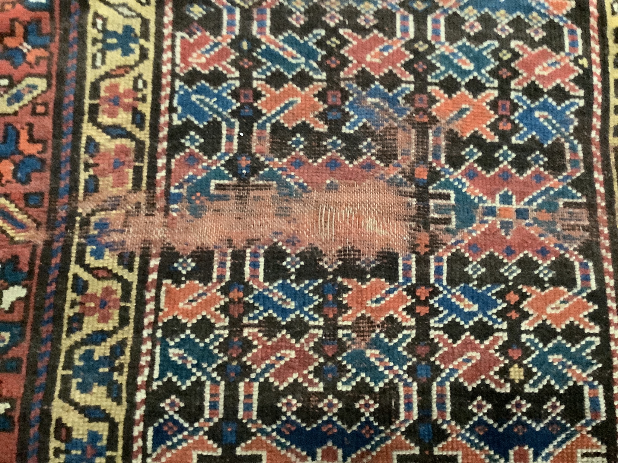 An antique Caucasian geometric runner 340 x 104cm, a machined rug and a Kelim rug